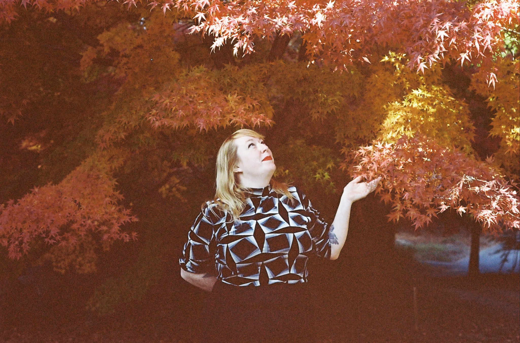 Ava Mees List beneath autumn leaves